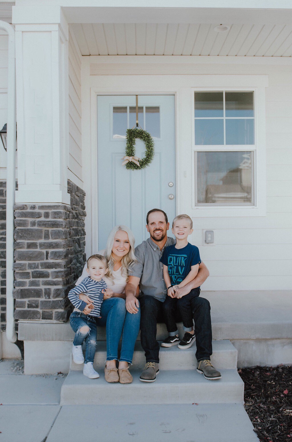 new home family on front porch